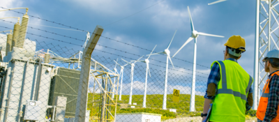 Technicians inspecting wind turbines